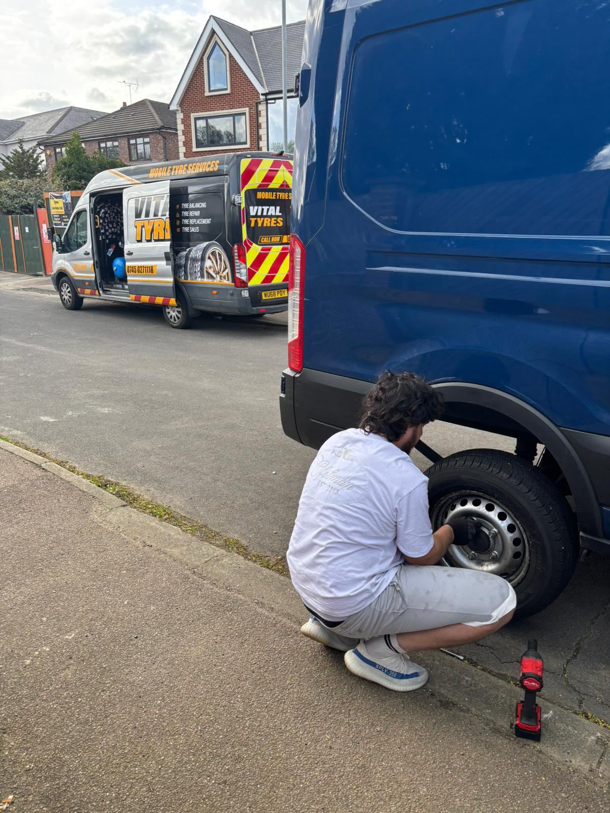 Two Vital Tyres vans at a job in East London